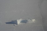 Frozen sea with iceberg