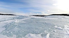 Lake with broken ice surface